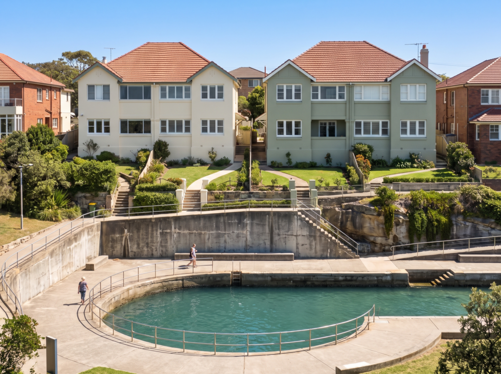 Renovated interwar semis above the concrete-ringed bay at Clovelly