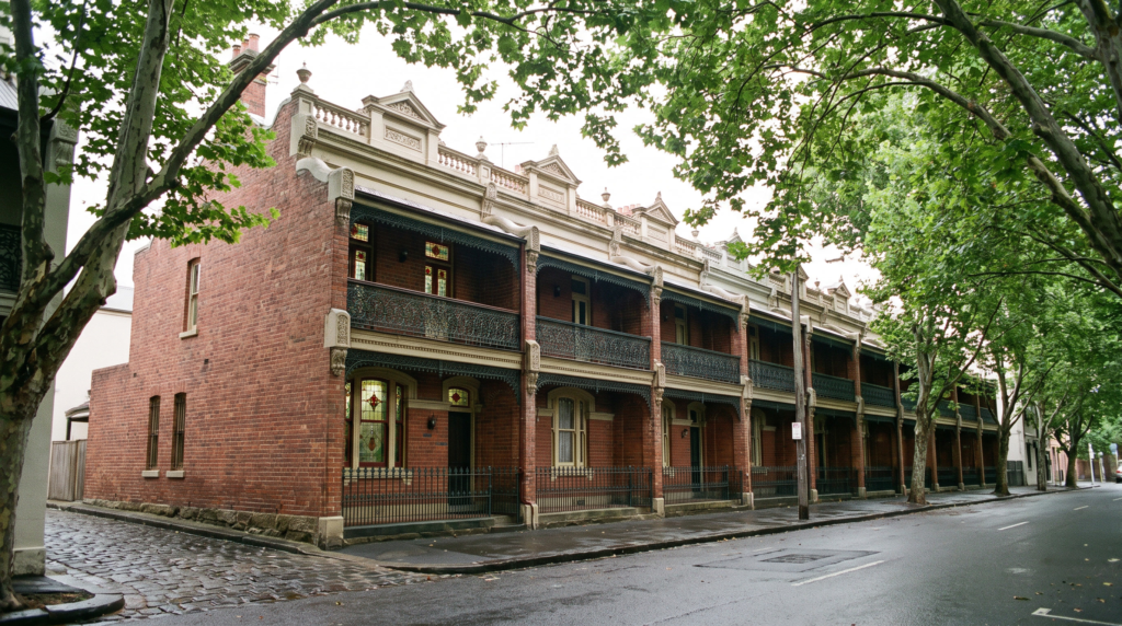 Row of restored Victorian terraces with clean brickwork and parapet gutters on an Inner West Sydney street