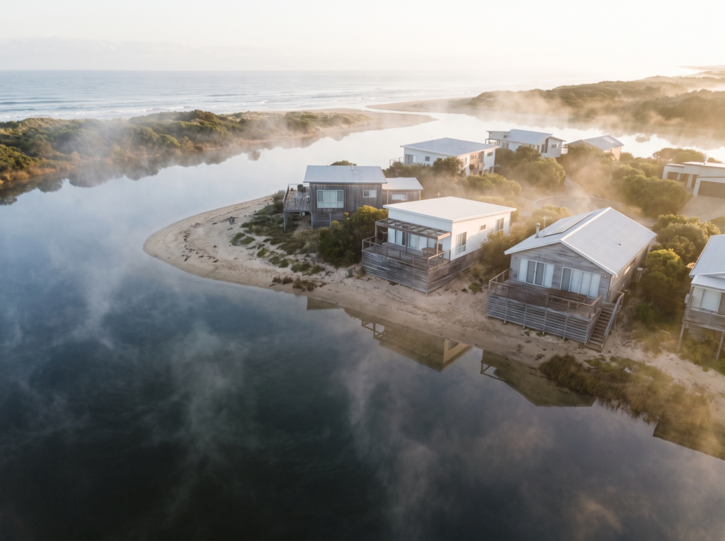 Narrabeen homes with timber decks between the lagoon and the surf beach