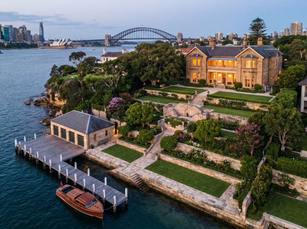 Grand Point Piper harbourfront estate with terraced sandstone gardens and boathouse